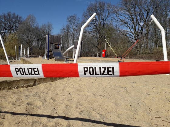 Coronavirus crisis police tape around a playground in Hamburg