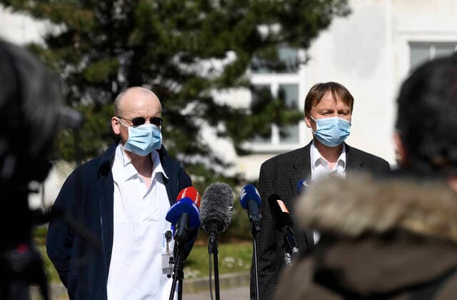 Doctor Martin Balik, left, and director of the General Teaching Hospital in Prague David Feltl, right, speak during a press conference on coronavirus treatment, on March 27, 2020, in Prague, Czech Republic. The condition of a Czech COVID-19 patient has markedly improved after the U.S. remdesivir experimental medicine was administered to him for three days. (CTKxPhoto MichalxKrumphanzl) CTKPhotoP202003270480601 kru 5