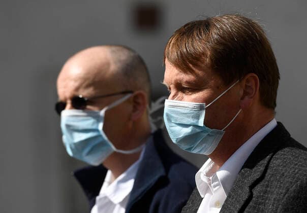 Doctor Martin Balik, left, and director of the General Teaching Hospital in Prague David Feltl, right, speak during a press conference on coronavirus treatment, on March 27, 2020, in Prague, Czech Republic. The condition of a Czech COVID-19 patient has markedly improved after the U.S. remdesivir experimental medicine was administered to him for three days. (CTKxPhoto MichalxKrumphanzl) CTKPhotoP202003270481601 kru 7 K