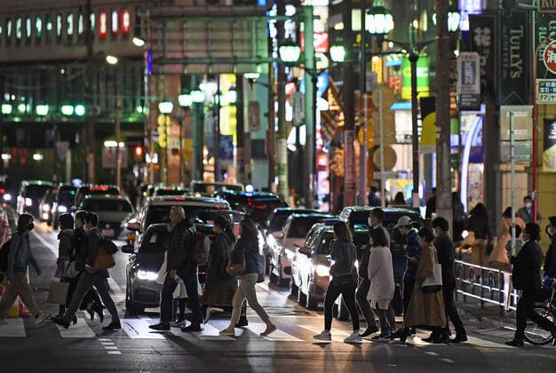 New coronavirus A large number of people walk in Tokyo s Roppongi entertainment district on March 27, 2020. Tokyo Gov. Yuriko Koike called on residents two days earlier to refrain from going out at night amid growing concerns over the spread of the new coronavirus in the capital. 