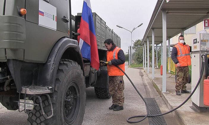 BERGAMO, ITALY - MARCH 27, 2020: Pictured in this video grab is a Russian Army truck being refilled at an Italian Air Force base, on the outskirts of Bergamo in Alpine Lombardy, one of the worst hit regions of Italy during the pandemic of the novel coronavirus (COVID-19). Russia has sent more than 100 military virologists, epidemiologists and CBRN specialists to Italy to help battle the pandemic. Russian military specialists are involved in sanitising and disinfecting healthcare facilities, urban infrastructure, and vehicles. Video grab. Defence Ministry of the Russian Federation TASS  TS0D38D7