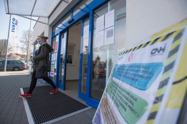 An employee last morning shift of bus manufacturer Iveco CZ (Iveco Bus) leaves Iveco s plant in Vysoke Myto, Czech Republic, after decision to shutdown of the plant in relation to coronavirus outbreak, on March 27, 2020. (CTKxPhoto JosefxVostarek) CTKPhotoP202003270567301 JVO 002