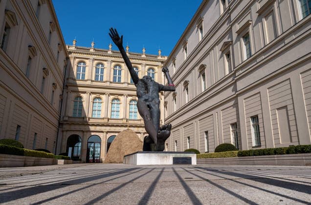 Potsdam State Capital State of Brandenburg 27 03 2020 MUSEUM BABERINI Inner courtyard with sculpture Wolfgang MATTHEUER DER JAHRHUNDERTSCHRITT Bronze 1984 The Barberini Museum is an art museum in the centre of the Brandenburg state capital Potsdam The museum is located in the classicist baroque Barberini Palace, which was reconstructed between 2013 and 2016.
