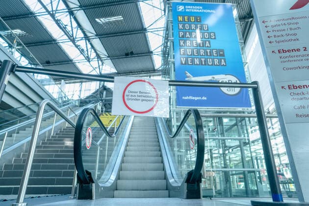 Airport Dresden Blocked escalators at deserted Dresden Airport All check-in counters are unmanned and closed Maximum one flight takes off or lands during the day ¨