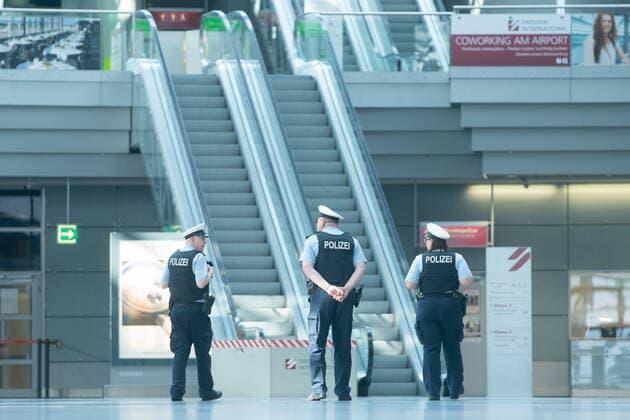 Dresden Airport Federal police officers stand in the deserted Dresden Airport All check-in counters are unmanned and closed Maximum one flight takes off or lands during the day ¨