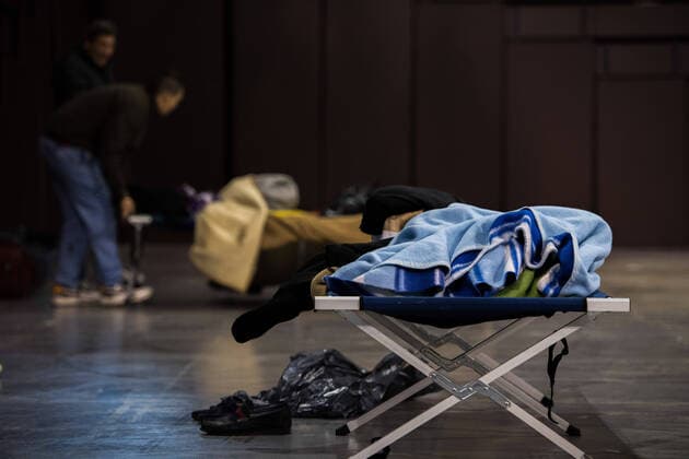 March 27, 2020, Granada, Spain: A homeless person rests on a stretcher inside Sports Palace during the state of emergency..The homeless people of Granada have been transferred to the Sports Palace pavilion during the state of emergency decreed by the Spanish Government. In Spain there are more than 64,000 infected and almost 5,000 deaths by COVID-19. Granada Spain - ZUMAs197 20200327_zaa_s197_059 Copyright: xCarlosxGilx