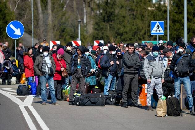 Large crowd of Ukrainian citizens is waiting to cross the border and return home at the Polish-Ukrainian crossing border in Korczowa Large crowd of Ukrainian citizens is waiting to cross the border and return home at the Polish-Ukrainian crossing border on March 27, 2020 in Korczowa, Poland EN_01422104_0006 