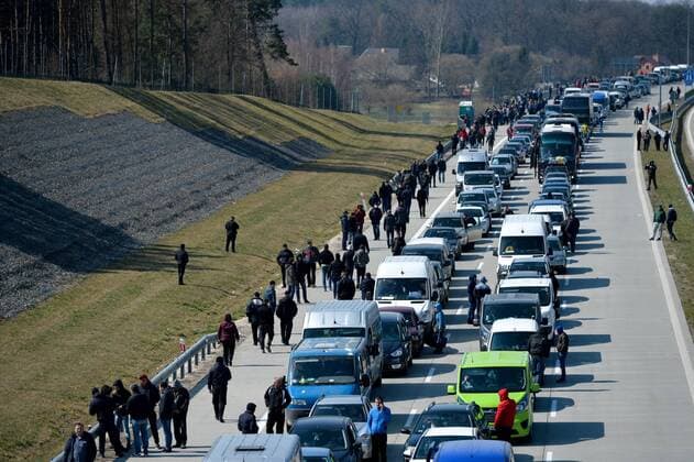 Large crowd of Ukrainian citizens is waiting to cross the border and return home at the Polish-Ukrainian crossing border in Korczowa Large crowd of Ukrainian citizens is waiting to cross the border and return home at the Polish-Ukrainian crossing border on March 27, 2020 in Korczowa, Poland EN_01422104_0007 