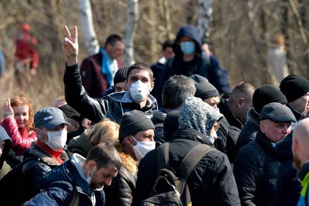 Large crowd of Ukrainian citizens is waiting to cross the border and return home at the Polish-Ukrainian crossing border in Korczowa Large crowd of Ukrainian citizens is waiting to cross the border and return home at the Polish-Ukrainian crossing border on March 27, 2020 in Korczowa, Poland EN_01422104_0011 