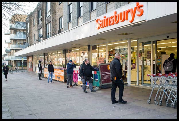 . 27 03 2020. London, United Kingdom. Social Distancing. Customers keeping two metres apart in a queue at a branch of SainsburyÕs.  xMartynxWheatleyx xi-Imagesx IIM-20963-0003