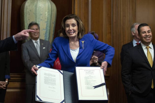 Speaker of the House Nancy Pelosi holds a signing ceremony after the House passed the $2.2 trillion CARES Act at the U.S. Capitol on Friday, March 27, 2020 in Washington, D.C. The stimulus bill, the largest in U.S history, provides economic bailouts to companies, independent contractors and includes direct payments to individuals as the U.S. suffers from the COVID-19 pandemic.  WAP202003278025 STEFANIxREYNOLDS