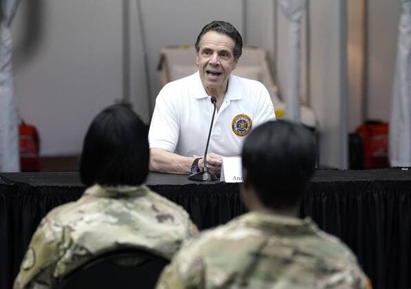 Gov. Andrew Cuomo speaks with the New York National Guard on site at the Jacob K. Javits Convention Center in New York City on Friday, March 27, 2020. The Javits Center is setting up to be turned into field hospitals to test and possibly treat cases of COVID-19 infections. Almost half of the United States are under stay-at-home orders and the United States has become the country with the most confirmed coronavirus cases at over 94,000.  NYP20200327102 JOHNxANGELILLO