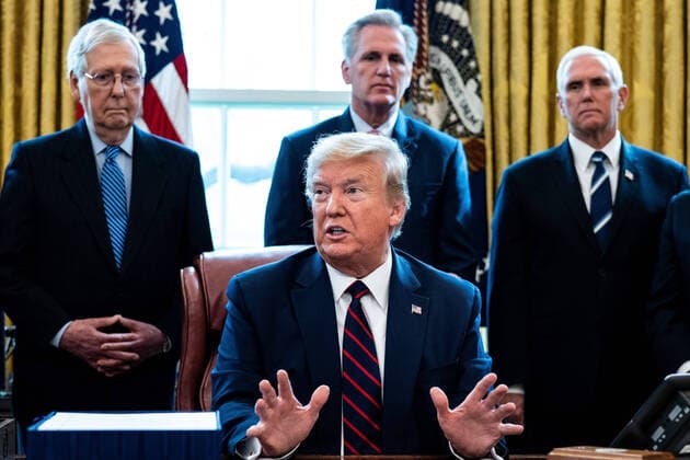March 27, 2020, Washington, District of Columbia, USA: United States President Donald J. Trump participates in a signing ceremony for a two trillion dollar coronavirus relief bill in the Oval Office at the White House in Washington, DC on March 27, 2020. Standing behind the President from left to right: US Senate Majority Leader Mitch McConnell (Republican of Kentucky); US House Minority Leader Kevin McCarthy (Republican of California); and US Vice President Mike Pence Washington USA - ZUMAs152 20200327_zaa_s152_014 Copyright: xErinxSchaffx