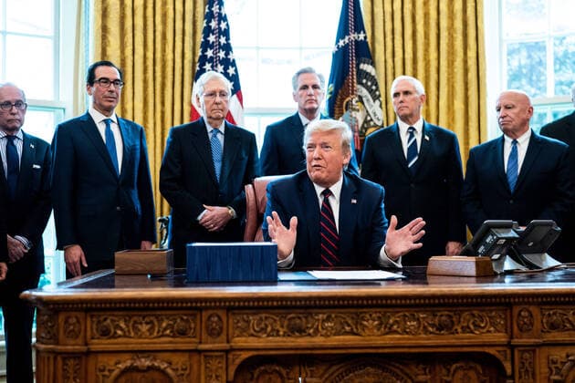 President Donald Trump participates in a signing ceremony for a two trillion dollar coronavirus relief bill in the Oval Office at the White House in Washington, DC on March 27, 2020. The economic stimulus package, the largest in U.S. history, provides economic bailouts to companies, independent contractors and includes direct payments to individuals as the U.S. suffers from the COVID-19 pandemic.  WAX20200327402 ERINxSCHAFF
