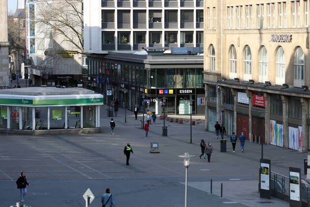 Fear of the coronavirus On a sunny Friday afternoon, only a few people are still moving because of the ban on contact during the corona crisis on the otherwise well-visited Willy Brandt Platz Essen North Rhine-Westphalia Germany Willy Brandt Platz