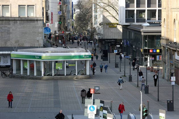 Fear of the coronavirus On a sunny Friday afternoon, only a few people are still moving because of the ban on contact during the corona crisis on the otherwise well-visited Willy Brandt Platz Essen North Rhine-Westphalia Germany Willy Brandt Platz