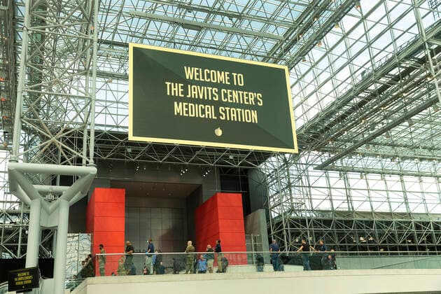 NY: Andrew Cuomo addresses National Guard members Welcome message to makeshift hospital displayed at Jacob Javits Center New York New York United States Copyright: LevxRadin