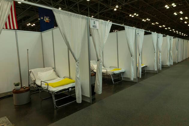NY: Andrew Cuomo addresses National Guard members View of row makeshift hospital rooms built by National Guard members at Jacob Javits Center New York New York United States Copyright: LevxRadin
