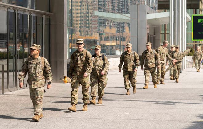NY: Andrew Cuomo addresses National Guard members National Guard members seen outside of Jacob Javits Center heading to Governor Andrew Cuomo address New York New York United States Copyright: LevxRadin