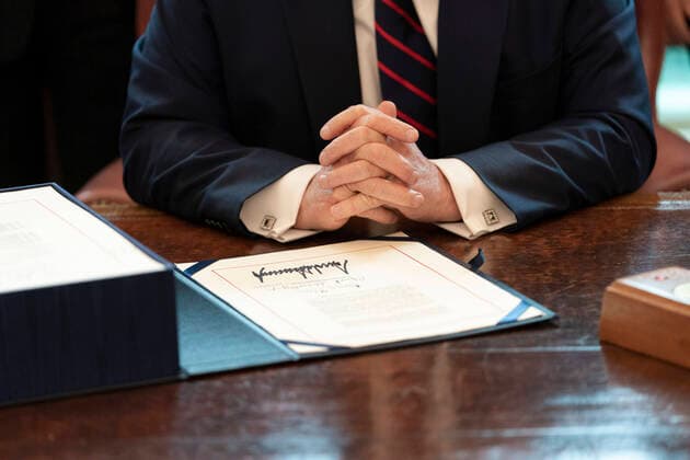 March 27, 2020, Washington, The District of Columbia, United States Of America: President Donald J. Trumps signature is seen on the Ã’Coronavirus Aid, Relief, and Economic Security (CARES) Act,O a $2.2 trillion emergency assistance bill in response to the coronavirus pandemic Friday, March 27, 2020, in the Oval Office of the White House. ..People: President Donald J. Trump. Washington United States Of America - ZUMAs214 20200327_zaa_s214_004 Copyright: xSMGx