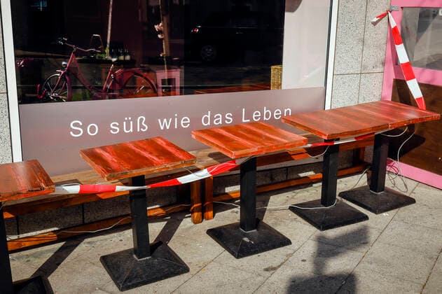 27 03 2020, Essen, Ruhr area, North Rhine-Westphalia, Germany Coronakrise, closed shops and restaurants on Ruettenscheider Strasse, here the Cafe Zucca with red and white fluttering band, outside area closed off, SO SUESS AS LIFE Essen North Rhine-Westphalia Germany