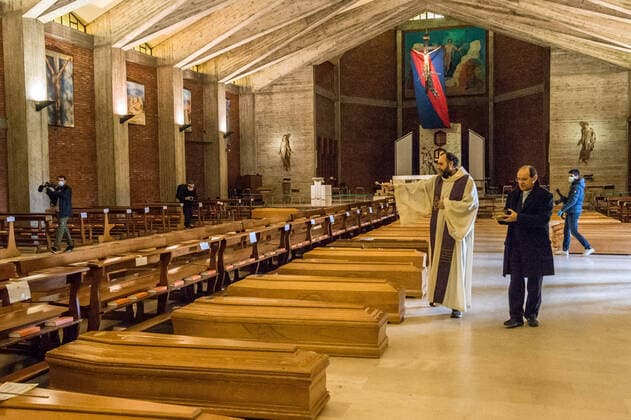 Seriate. Bergamo. Blessing of 90 bodies by Don Marcello Crotti parish priest of the church of San Giuseppe in Seriate waiting place before cremation of people who died as a result of COVID19 Coronavirus (Carlo Cozzoli Fotogramma, Seriate - 2020-03-28) p.s. la foto e utilizzabile nel rispetto del contesto in cui e stata scattata, e senza intento diffamatorio del decoro delle persone rappresentate  Copyright: xCarloxCozzolix xFOTOGRAMMAx