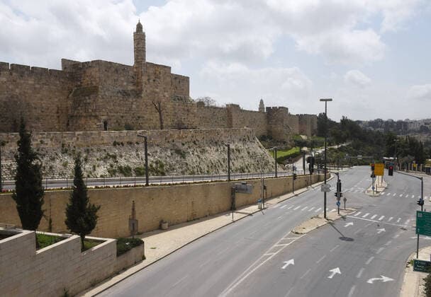 An empty street is seen, outside of Jerusalem s Old City, as people are staying home in compliance with coronavirus movement restrictions, on Saturday, March 28, 2020. The Israeli government has imposed tight restrictions of movement, leaving only essential stores open in an effort to stop the spread of the coronavirus disease.  JER2020032819 DEBBIExHILL