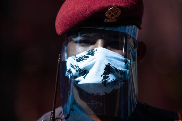 Manufacturing free face shields amid COVID-19 A Nepal police wearing a protective face shields manufacturing by Locals peoples of Kathmandu on the fifth day of Lockdown imposed by Nepal government amid concerns about the spread of Corona virus (COVID-19) outbreak in Kathmandu Nepal, on Friday, 28 March, 2020.Peoples currently manufacturing approximately 200 face shields PPE per day. kathmandu 2 Nepal Copyright: PrabinxRanabhat
