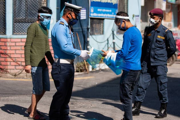 Manufacturing free face shields amid COVID-19 Locals of Kathmandu distribute a face shields to on duty security personnel, on the fifth day of Lockdown imposed by Nepal government amid concerns about the spread of Corona virus (COVID-19) outbreak in Kathmandu Nepal, on Friday, 28 March, 2020.Peoples currently manufacturing approximately 200 face shields PPE per day. kathmandu 2 Nepal Copyright: PrabinxRanabhat