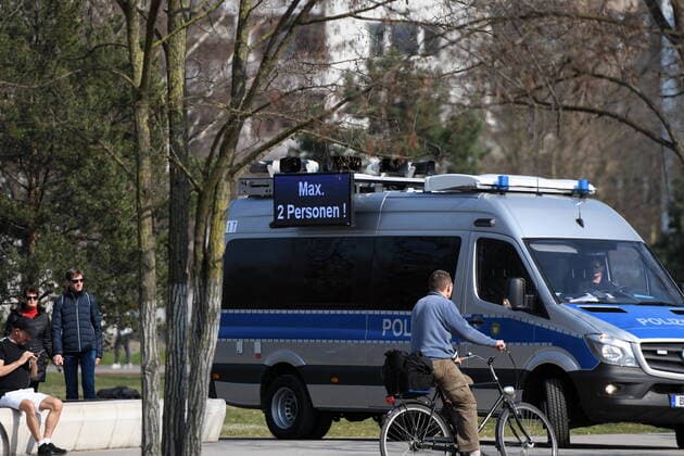Berlin policemen point out the exit and contact blocks They also make loudspeaker announcements and ask everyone who is sitting or lying down on the lawn in the park at Gleisdreieck to move away.