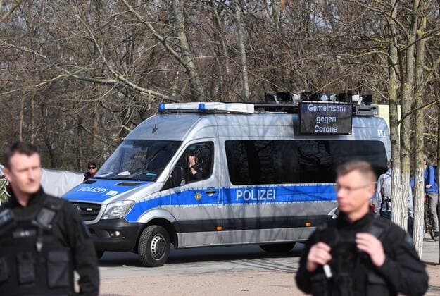 Berlin policemen point out the exit and contact blocks They also make loudspeaker announcements and ask everyone who is sitting or lying down on the lawn in the park at Gleisdreieck to move away.