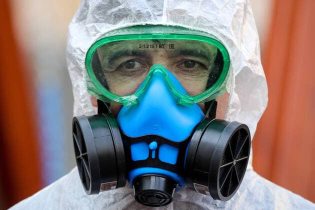 MOSCOW, RUSSIA - MARCH 28, 2020: A sanitary worker in a protective suit, respirator and goggles disinfects a children s playground in a residential area of Moscow. Since 5 March, Moscow has been on high alert in connection with the pandemic of the novel coronavirus (COVID-19). Streets and other public areas are cleaned and disinfected to counter the spread of the novel coronavirus. As of 28 March 2020, Russia has reported more than 1200 confirmed cases of the novel coronavirus (COVID-19), with more than 800 confirmed cases in Moscow. Sergei Bobylev TASS  TS0D3B22