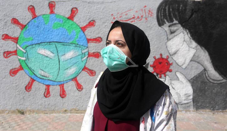 March 28, 2020, Khan Younis, Gaza Strip, Palestinian Territory: Palestinian artists draw a mural during awareness campaign about the coronavirus COVID-19, in Khan Younis in the southern of Gaza Strip on March 28, 2020 Khan Younis Palestinian Territory - ZUMAap3_ 20200328_zaf_ap3_004 Copyright: xAshrafxAmrax