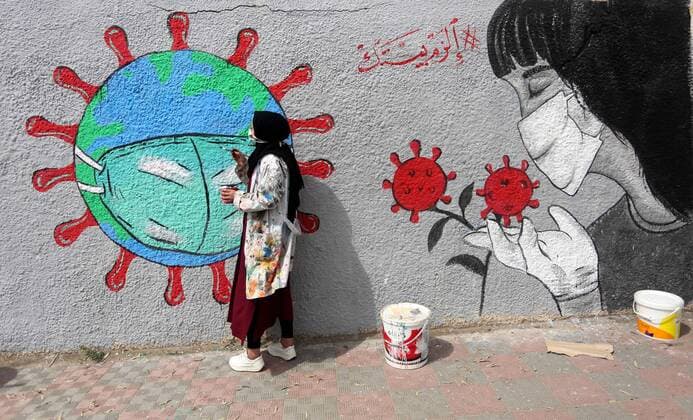 March 28, 2020, Khan Younis, Gaza Strip, Palestinian Territory: Palestinian artists draw a mural during awareness campaign about the coronavirus COVID-19, in Khan Younis in the southern of Gaza Strip on March 28, 2020 Khan Younis Palestinian Territory - ZUMAap3_ 20200328_zaf_ap3_011 Copyright: xAshrafxAmrax