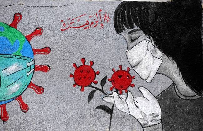 March 28, 2020, Khan Younis, Gaza Strip, Palestinian Territory: Palestinian artists draw a mural during awareness campaign about the coronavirus COVID-19, in Khan Younis in the southern of Gaza Strip on March 28, 2020 Khan Younis Palestinian Territory - ZUMAap3_ 20200328_zaf_ap3_029 Copyright: xAshrafxAmrax