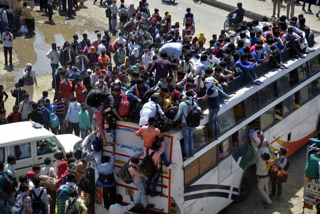 GHAZIABAD, INDIA - MARCH 28: An aerial view of Lal Kuan bus stand where a wave of migrant workers was seen following Uttar Pradesh government?s call to arrange buses for the workers returning to their native state, on Day 4 of the 21 day nationwide lockdown -- to check the spread of coronavirus, on March 28, 2020 in Ghaziabad, India. (Photo by Sakib Ali Hindustan Times ) Coronavirus Update: Amid Lockdown, A Sea Of Migrants In Delhi-NCR Try To Find Their Way Back Home