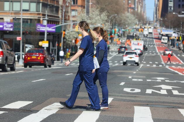 March 27, 2020, New York, NY, USA: NEW YORK, NY - MARCH 27: A general view of two nurses wearing masks crossing 1st Avenue in front of Bellevue Hospital on during the coronavirus (Covid-19) pandemic March 27, 2020 in New York, NY. ( Icon Sportswire) New York USA - ZUMAi88_ 20200327_zaf_i88_123 Copyright: xRichxGraesslex