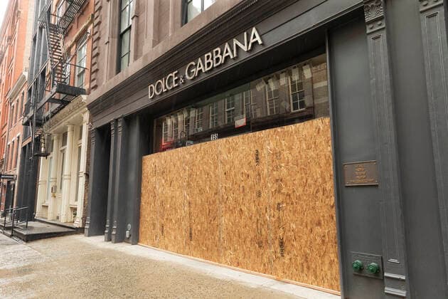 Sightseeing in New York City in times of COVID-19 Some high end stores like Dolce & Gabbana on Mercer Street boarding up with plywood windows and entrances to prevent looting in Manhattan New York New York United States Copyright: LevxRadin