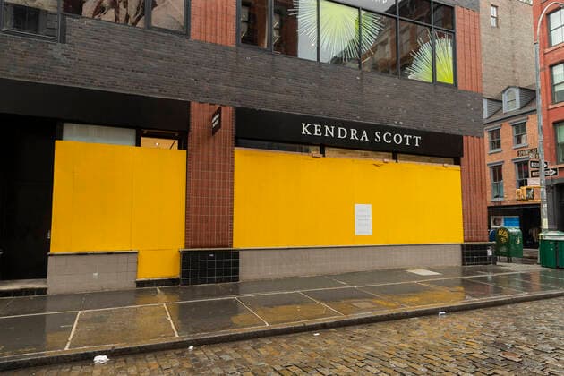Sightseeing in New York City in times of COVID-19 Some high end stores like Kendra Scott on Greene Street boarding up with plywood windows and entrances to prevent looting in Manhattan New York New York United States Copyright: LevxRadin