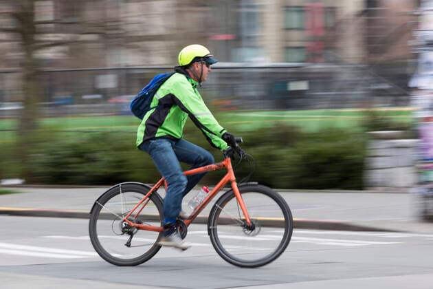 March 28, 2020, Seattle, Washington, U.S: A man rides his bicycle near Cal Anderson Park in Seattleâ€⠢s Capitol Hill neighborhood on Saturday, March 28, 2020. Under governor Jay Insleeâ€⠢s statewide stay home proclamation, now extended until April 6, people are able to leave their homes only for essential activities including grocery shopping, exercise and caring for a family member, friend or pet. Seattle U.S. - ZUMAg235 20200328_zap_g235_001 Copyright: xPaulxChristianxGordonx