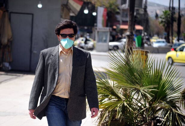(200329) -- DAMASCUS, March 29, 2020 -- A man is seen wearing a mask in Damascus, capital of Syria, on March 28, 2020. Syria has so far registered five coronavirus cases. (Photo by Xinhua) SYRIA-DAMASCUS-COVID-19-FIVE CASES AmmarxSafarjalani 