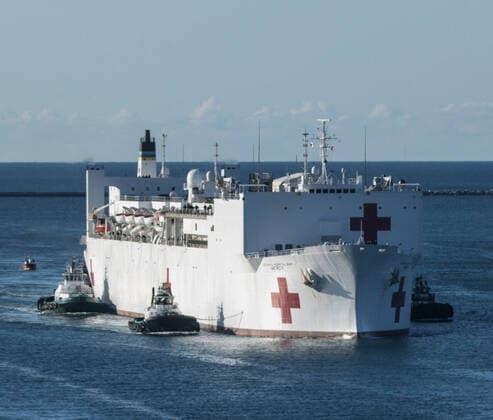 March 29, 2020, Los Angeles, California, United States Of America: LOS ANGELES, CA - MARCH 27: The Military Sealift Command hospital ship USNS Mercy (T-AH 19) arrives in Los Angeles, Calif., March 27, 2020. Mercy deployed in support of the nationâ€⠢s COVID-19 response efforts, and will serve as a referral hospital for non-COVID-19 patients currently admitted to shore-based hospitals. This allows shore base hospitals to focus their efforts on COVID-19 cases. One of the Department of Defenseâ€⠢s missions is Defense Support of Civil Authorities. DOD is supporting the Federal Emergency Management Agency, the lead federal agency, as well as state, local and public health authorities in helping protect the health and safety of the American people on March 27, 2020 in Los Angeles, California..People: USNS Mercy Los Angeles United St - ZUMAn287 20200329_zaa_n287_001 Copyright: xSMGx