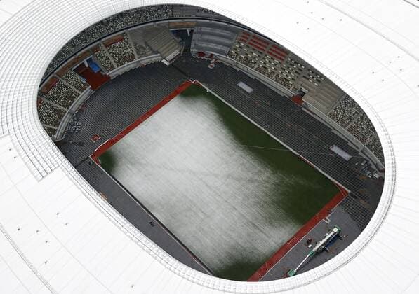 Out-of-season snow in Tokyo Photo taken March 29, 2020, from a Kyodo News helicopter shows Tokyo s National Stadium being covered with out-of-season snow. 