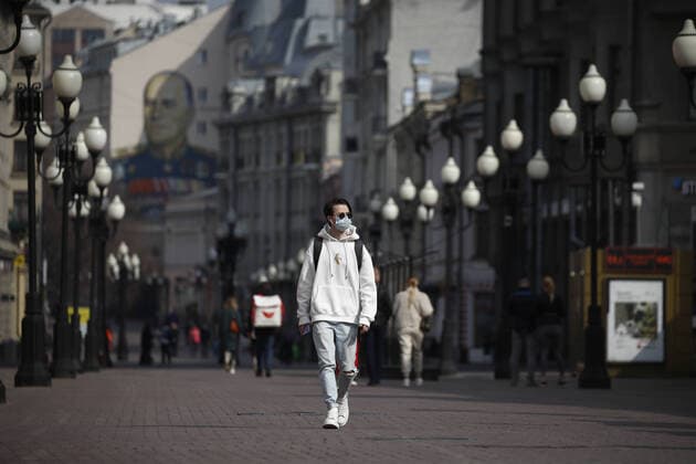 MOSCOW, RUSSIA - MARCH 29, 2020: A young man in a face mask walks in Stary Arbat Street during the pandemic of the novel coronavirus (COVID-19). As of 29 March 2020, Russia has reported more than 1200 confirmed cases of the novel coronavirus (COVID-19), with more than 1000 confirmed cases in Moscow. Artyom Geodakyan TASS  TS0D3C51