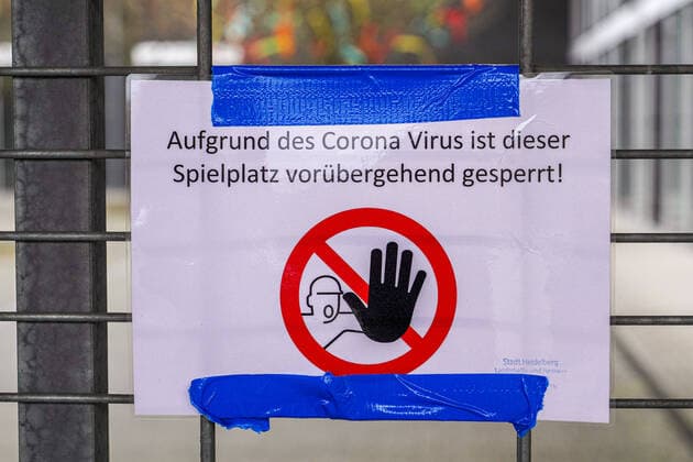 Impressions from Heidelberg district Kirchheim in Baden Württemberg in the days of the Corona contact ban, the picture shows a notice with the inscription Due to the Corona virus this playground is temporarily closed, official order, closure, barricade, site closure, notice, notice board, information sign, prohibition, prohibition sign, corona crisis, c xozx