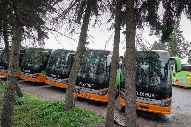 Flixbuses parked on a car park in Albrechtstrasse in Berlin Tempelhof Because of Corona Flixbuses parked on a car park in Albrechtstrasse in Berlin Tempelhof