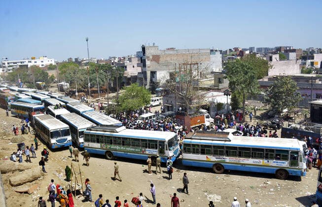 GHAZIABAD, INDIA - MARCH 29: An aerial view of the Lal Kuan bus stand where migrant workers are seen heading to their native state on buses arranged by the Uttar Pradesh government, on Day 5 of the 21 day nationwide lockdown imposed by PM Narendra Modi to curb the spread of coronavirus, on March 29, 2020 in Ghaziabad, India. (Photo by Sakib Ali Hindustan Times ) Migrant Workers Head Home In Coronavirus Lockdown