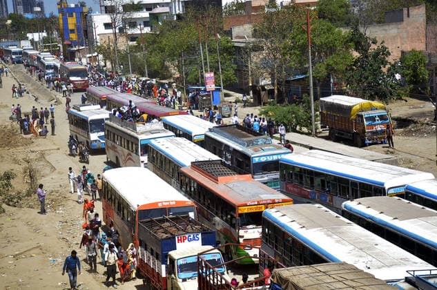 GHAZIABAD, INDIA - MARCH 29: An aerial view of the Lal Kuan bus stand where migrant workers are seen heading to their native state on buses arranged by the Uttar Pradesh government, on Day 5 of the 21 day nationwide lockdown imposed by PM Narendra Modi to curb the spread of coronavirus, on March 29, 2020 in Ghaziabad, India. (Photo by Sakib Ali Hindustan Times ) Migrant Workers Head Home In Coronavirus Lockdown