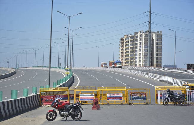 GHAZIABAD, INDIA - MARCH 29: Police barricades seen at UP Gate Nh9 road after the Uttar Pradesh administration cancelled buses from ISBT Kaushambi due to a huge rush of migrant workers heading home, on Day 5 of the 21 day nationwide lockdown imposed by PM Narendra Modi to curb the spread of coronavirus, on March 29, 2020 in Ghaziabad, India. (Photo by Sakib Ali Hindustan Times ) Migrant Workers Head Home In Coronavirus Lockdown
