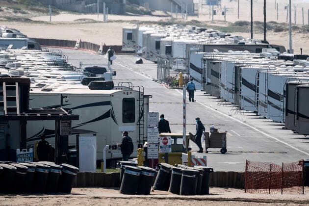 March 29, 2020, Los Angeles, California, U.S: Workers in RV s park at Dockweiler State Beach, in an area being used as an isolation zone for those who cannot self-isolate and are being asked to quarantine by the Los Angeles County Department of Health, amid the coronavirus pandemic on Sunday March 29, 2020 in Los Angeles, California. Los Angeles U.S. - ZUMAc68_ 20200329_zaf_c68_006 Copyright: xRingoxChiux